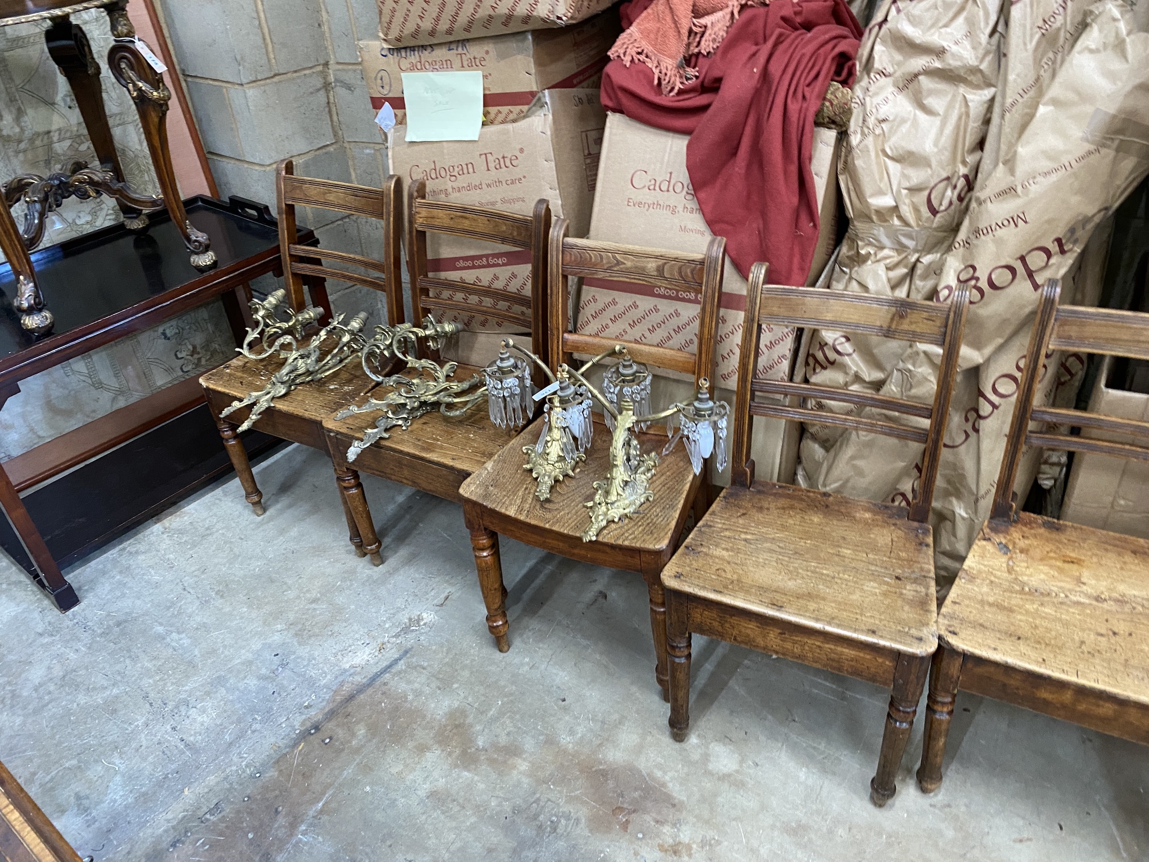 A harlequin set of nine early 19th century Provincial elm and fruitwood dining chairs